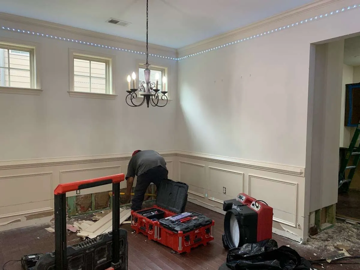 Restoration technician with professional equipment in West Greenwich